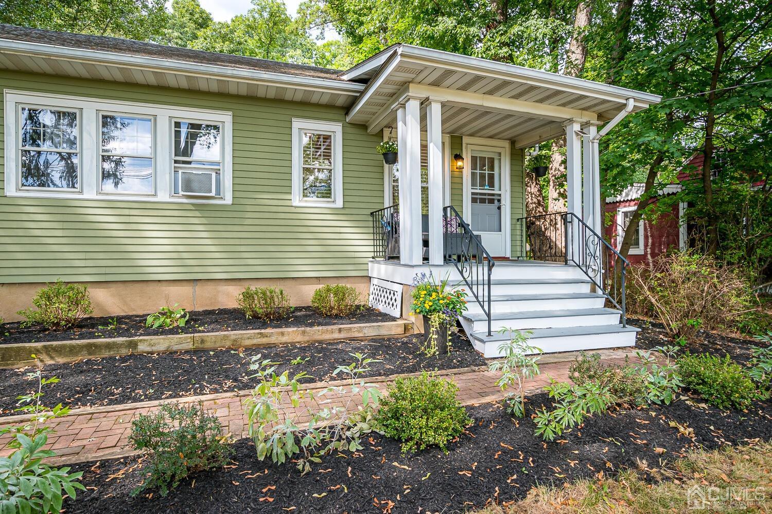 2015 Washington Valley Road Bridgewater, NJ 08836 - Photo 3 of 46 a front view of a house with garden
