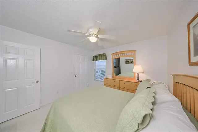 a bed room with a bed and a chandelier