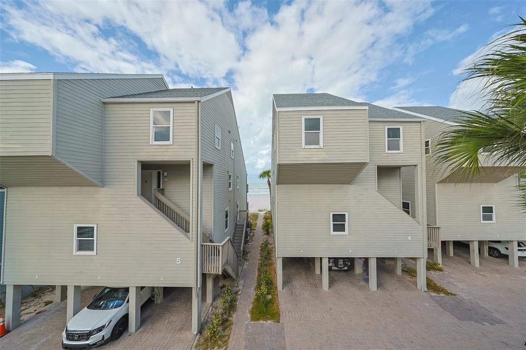19930 Gulf Boulevard, Unit 1B Indian Shores, FL 33785 - Photo 24 of 26 a aerial view of a house with a yard and balcony