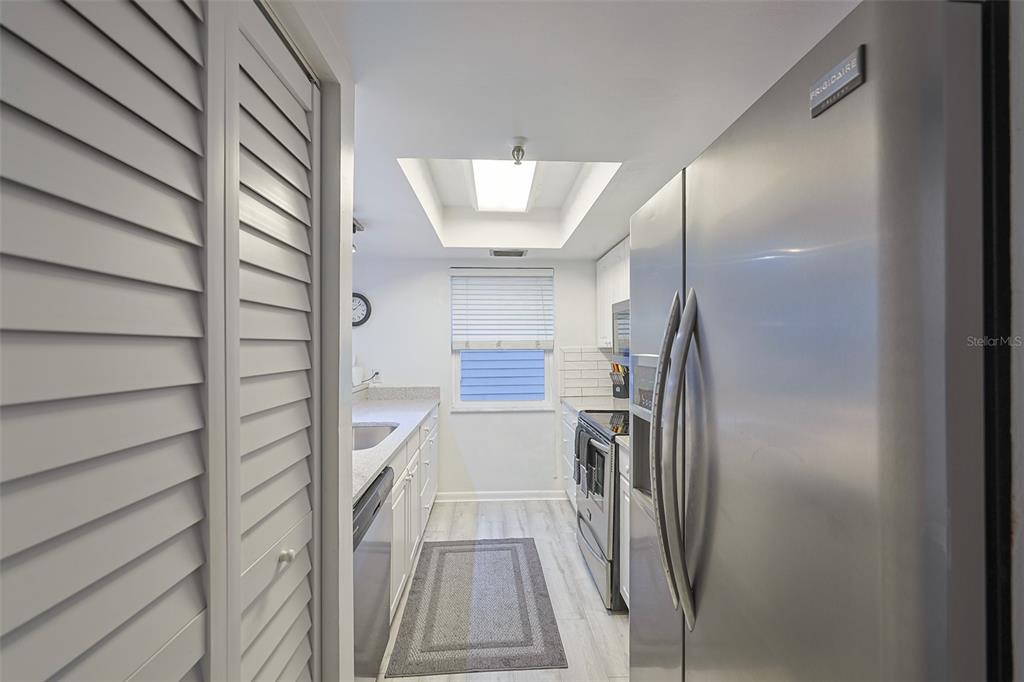 19930 Gulf Boulevard, Unit 1B Indian Shores, FL 33785 - Photo 7 of 26 a view of entryway with wooden floor