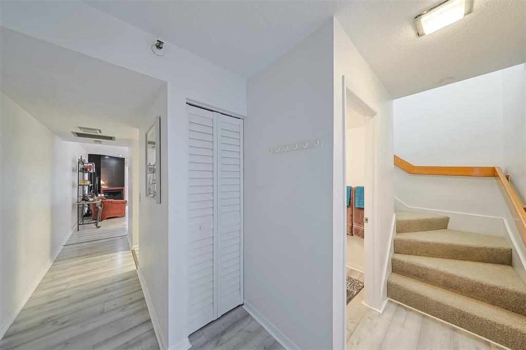 19930 Gulf Boulevard, Unit 1B Indian Shores, FL 33785 - Photo 10 of 26 a view of a hallway with wooden floor and entryway