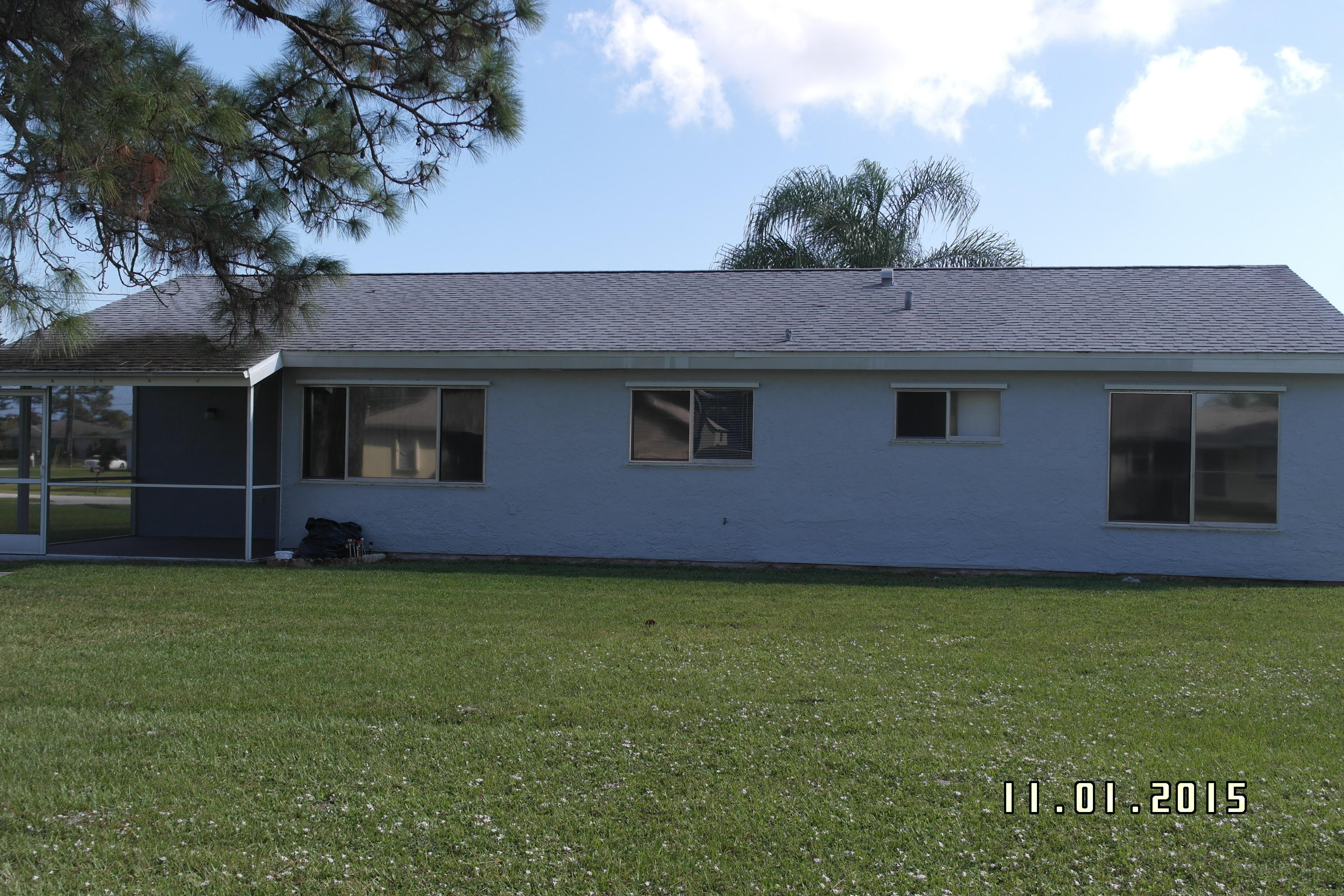 2132 Southeast Midtown Road Port St. Lucie, FL 34952 - Photo 7 of 20 Screen Enclosure on left