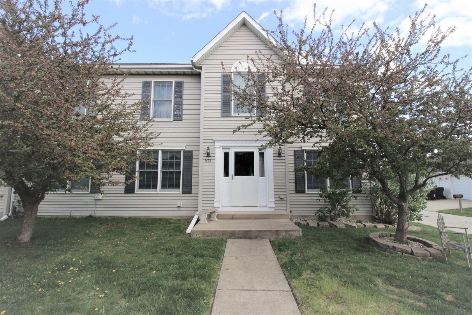 a view of house with yard