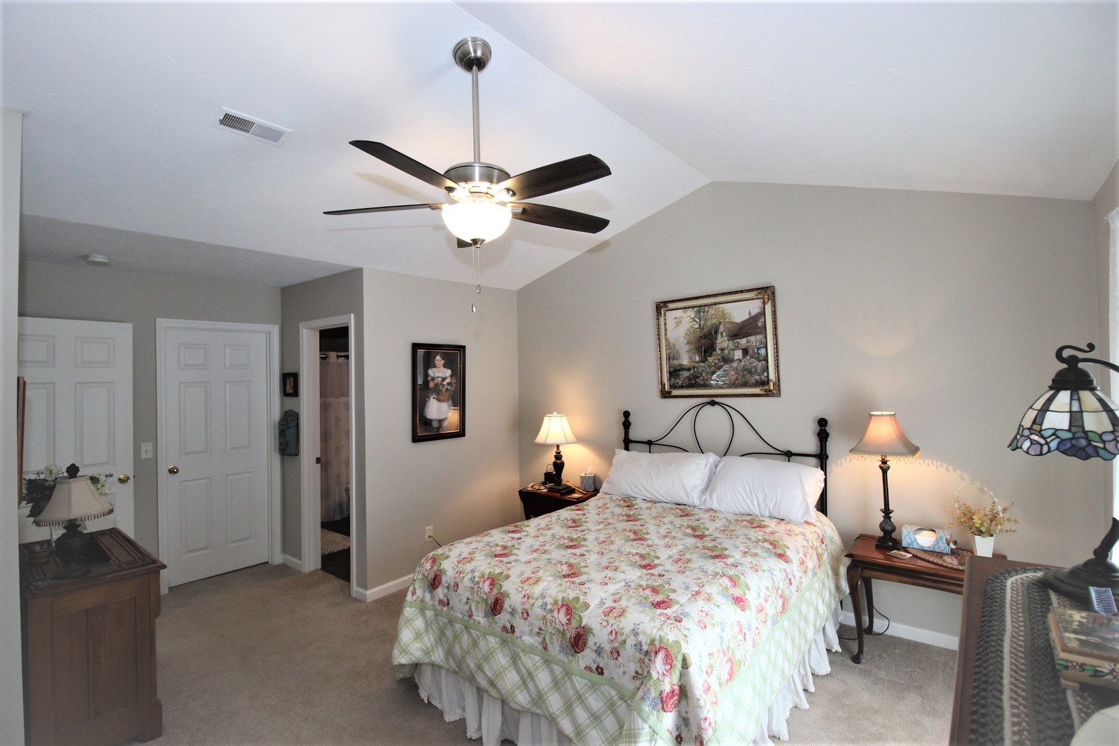 1409 Hull Street Normal, IL 61761 - Photo 19 of 29 a bedroom with a bed and a chandelier