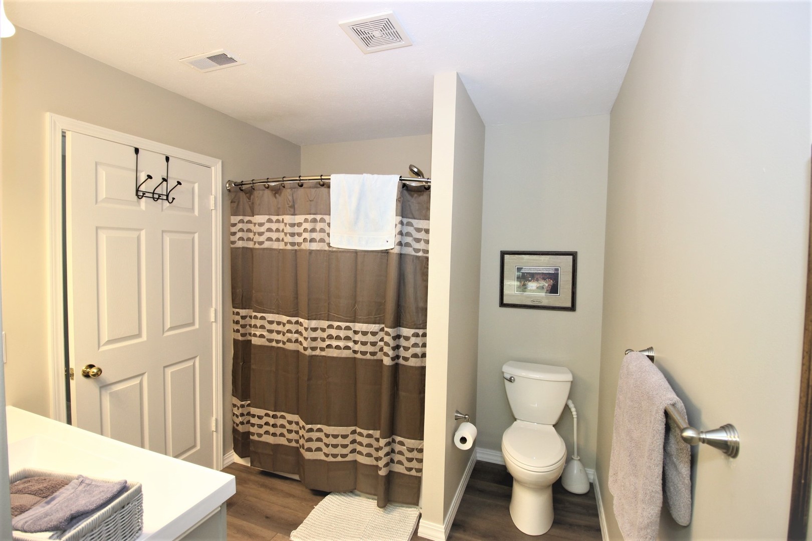 1409 Hull Street Normal, IL 61761 - Photo 24 of 29 a bathroom with a toilet sink and shower