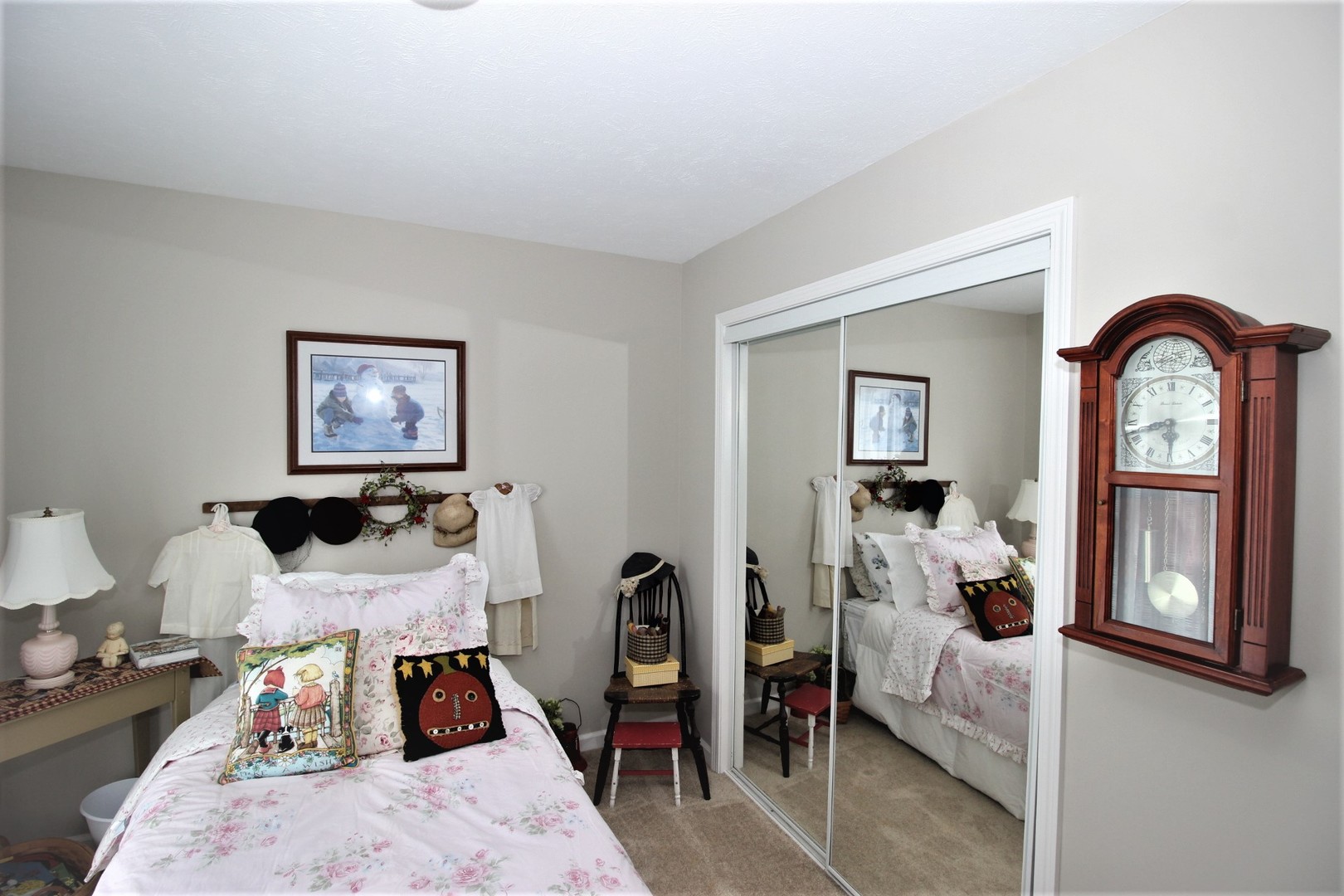 1409 Hull Street Normal, IL 61761 - Photo 26 of 29 a bedroom with a bed and a large mirror on the dresser
