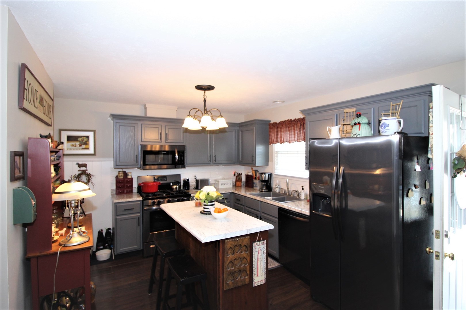 1409 Hull Street Normal, IL 61761 - Photo 3 of 29 a kitchen with a refrigerator and a sink