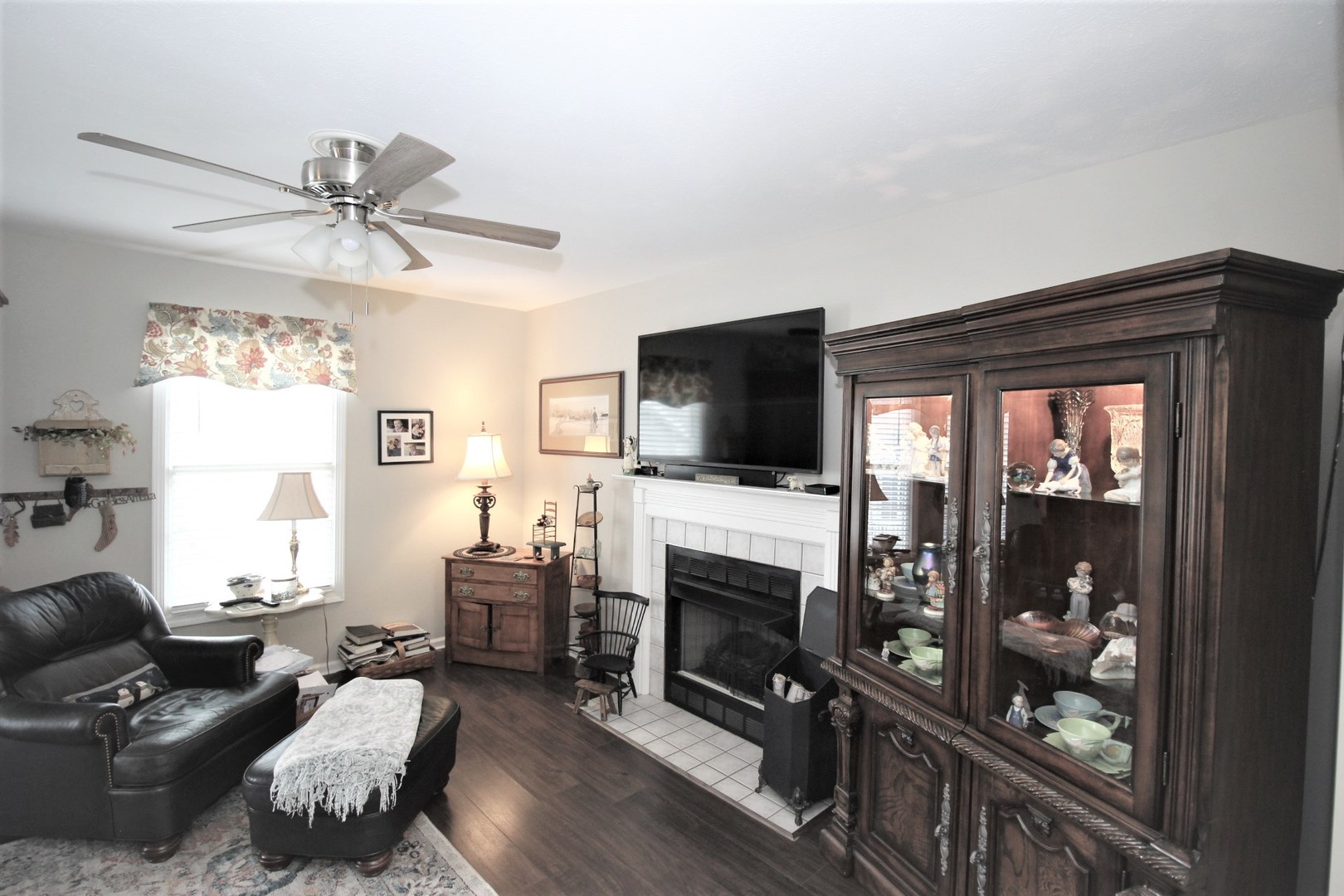 1409 Hull Street Normal, IL 61761 - Photo 7 of 29 a living room with furniture a flat screen tv and a fireplace