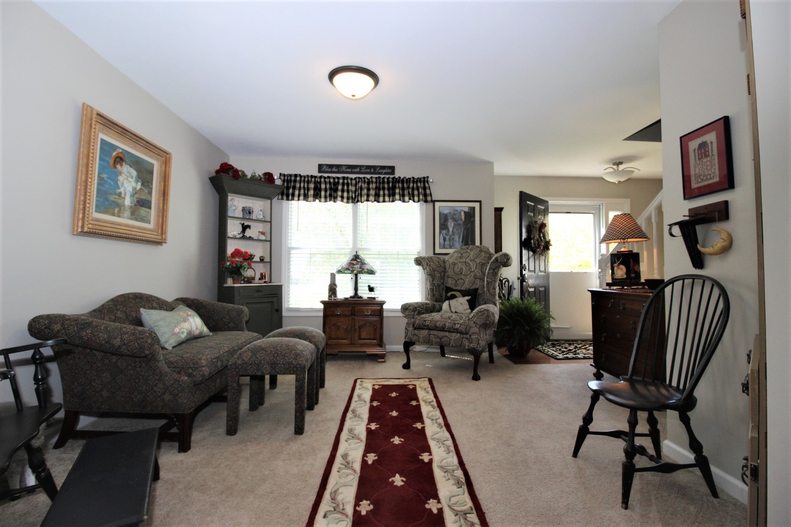 1409 Hull Street Normal, IL 61761 - Photo 9 of 29 a living room with furniture rug and window