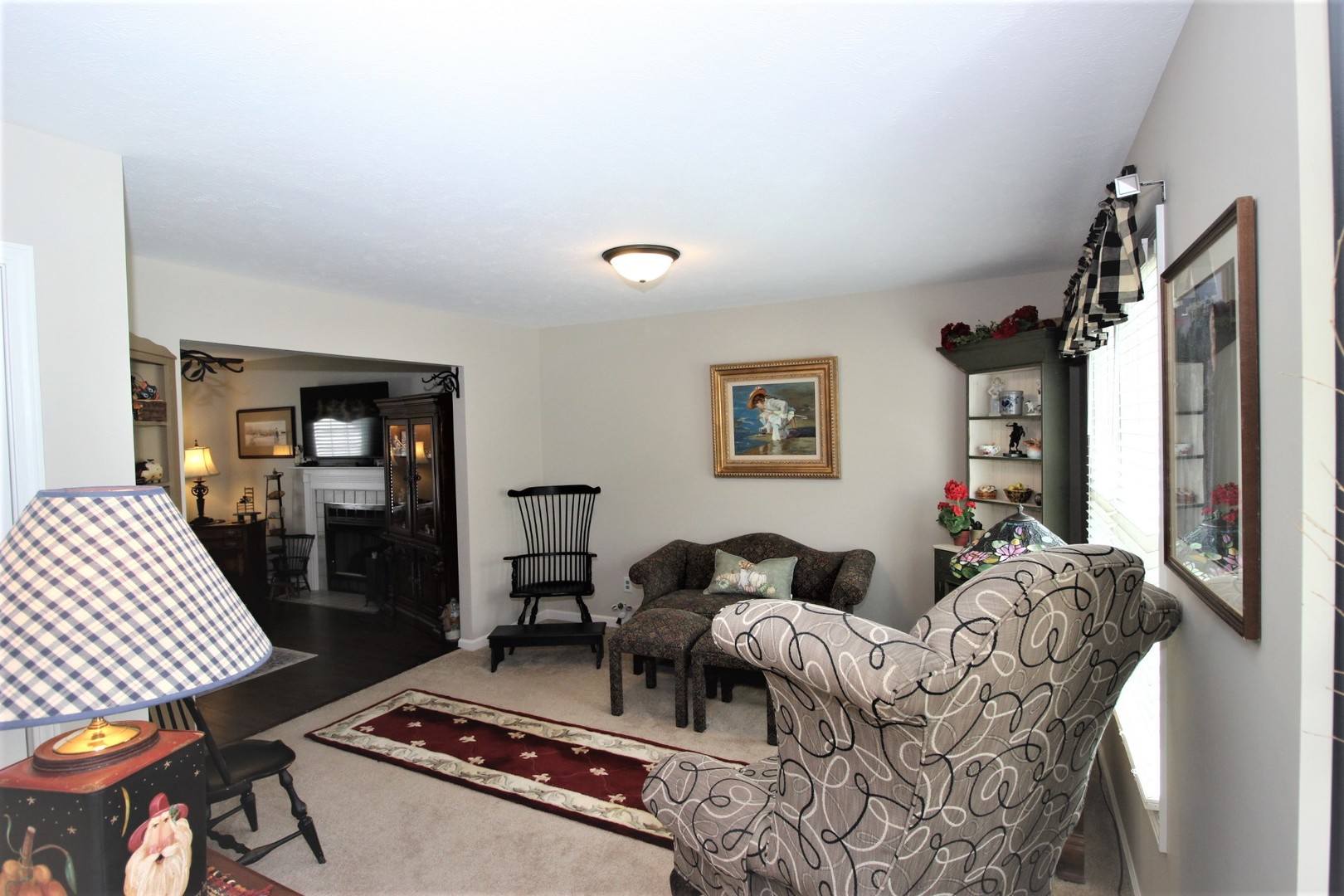 1409 Hull Street Normal, IL 61761 - Photo 10 of 29 a living room with furniture a lamp and a rug