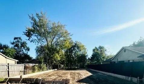 a view of a yard with an outdoor space