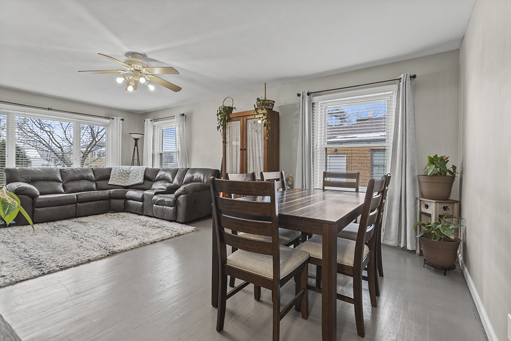 818 East 11th Street Lockport, IL 60441 - Photo 5 of 13 a living room with furniture a chandelier and a dining table