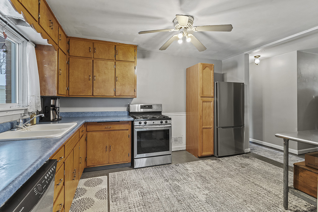 818 East 11th Street Lockport, IL 60441 - Photo 7 of 13 a kitchen with stainless steel appliances granite countertop a refrigerator a sink dishwasher with a stove and a refrigerator