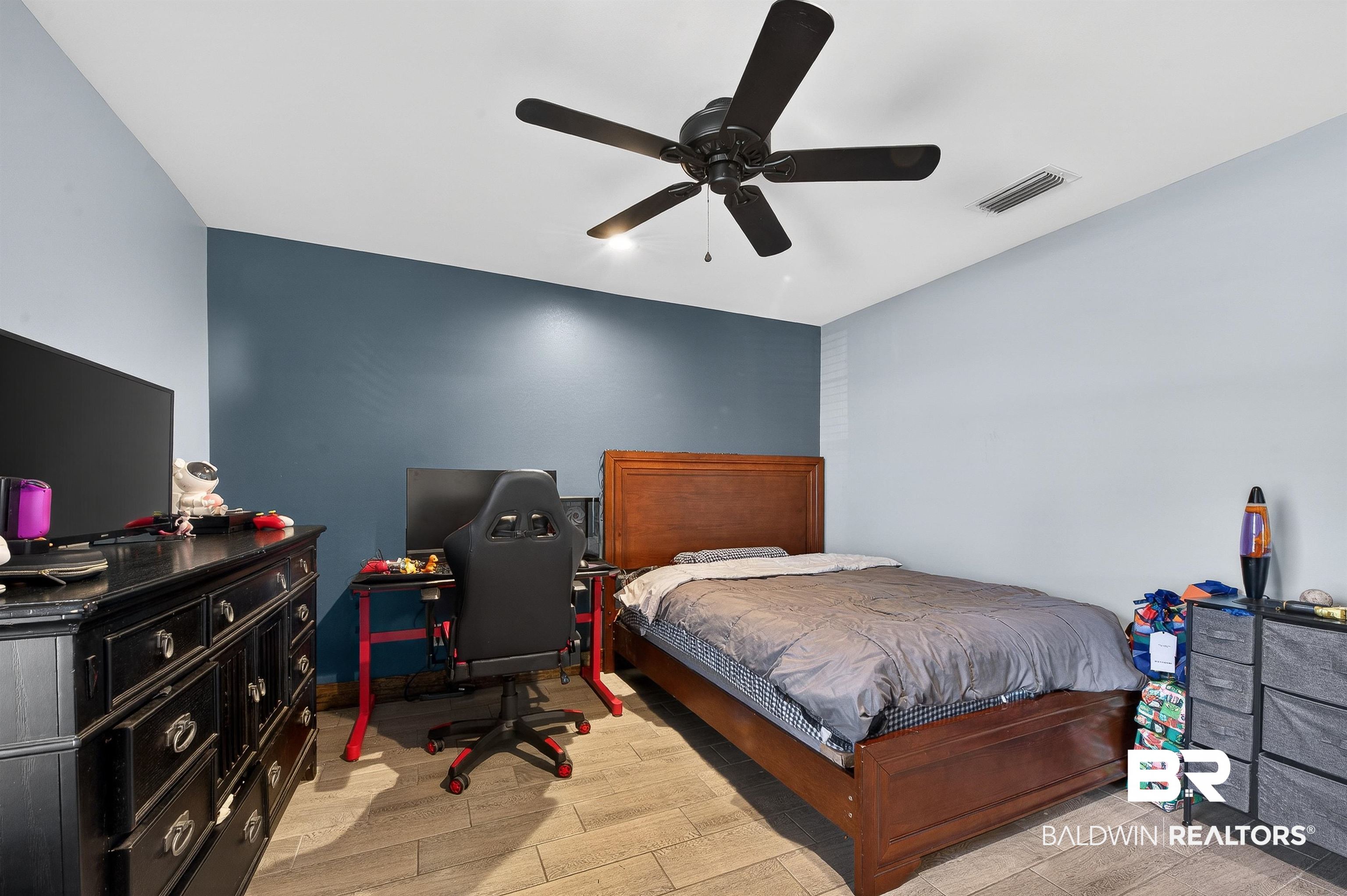 29635 Gardner Road Elberta, AL 36530 - Photo 40 of 66 Bedroom featuring wood tiled floors, ceiling fan, and a desk