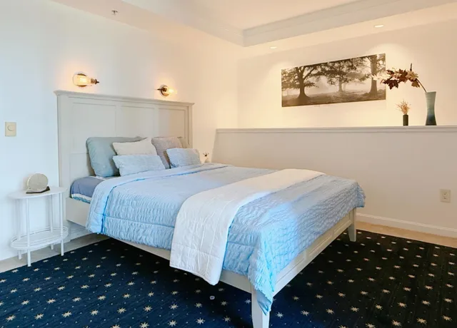 a bedroom with bed and window