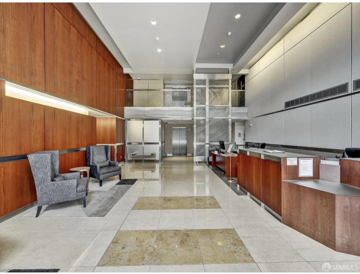 400 Beale Street, Unit 1102 San Francisco, CA 94105 - Photo 20 of 26 a lobby with furniture and a rug