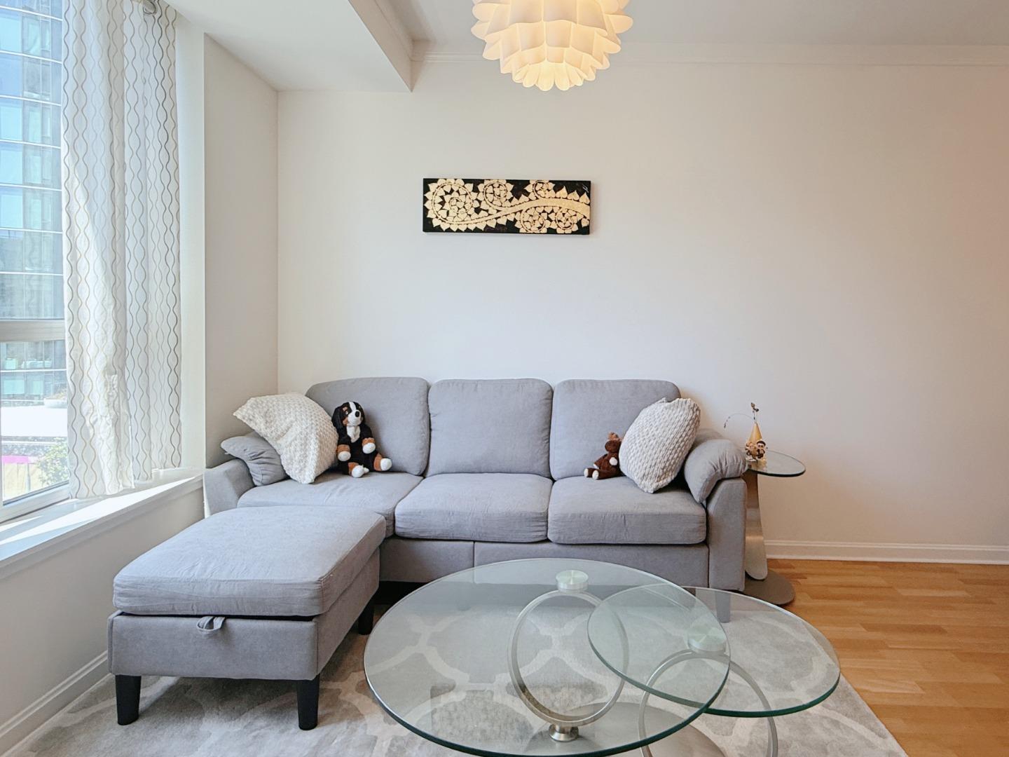 400 Beale Street, Unit 1102 San Francisco, CA 94105 - Photo 6 of 26 a living room with furniture and a window