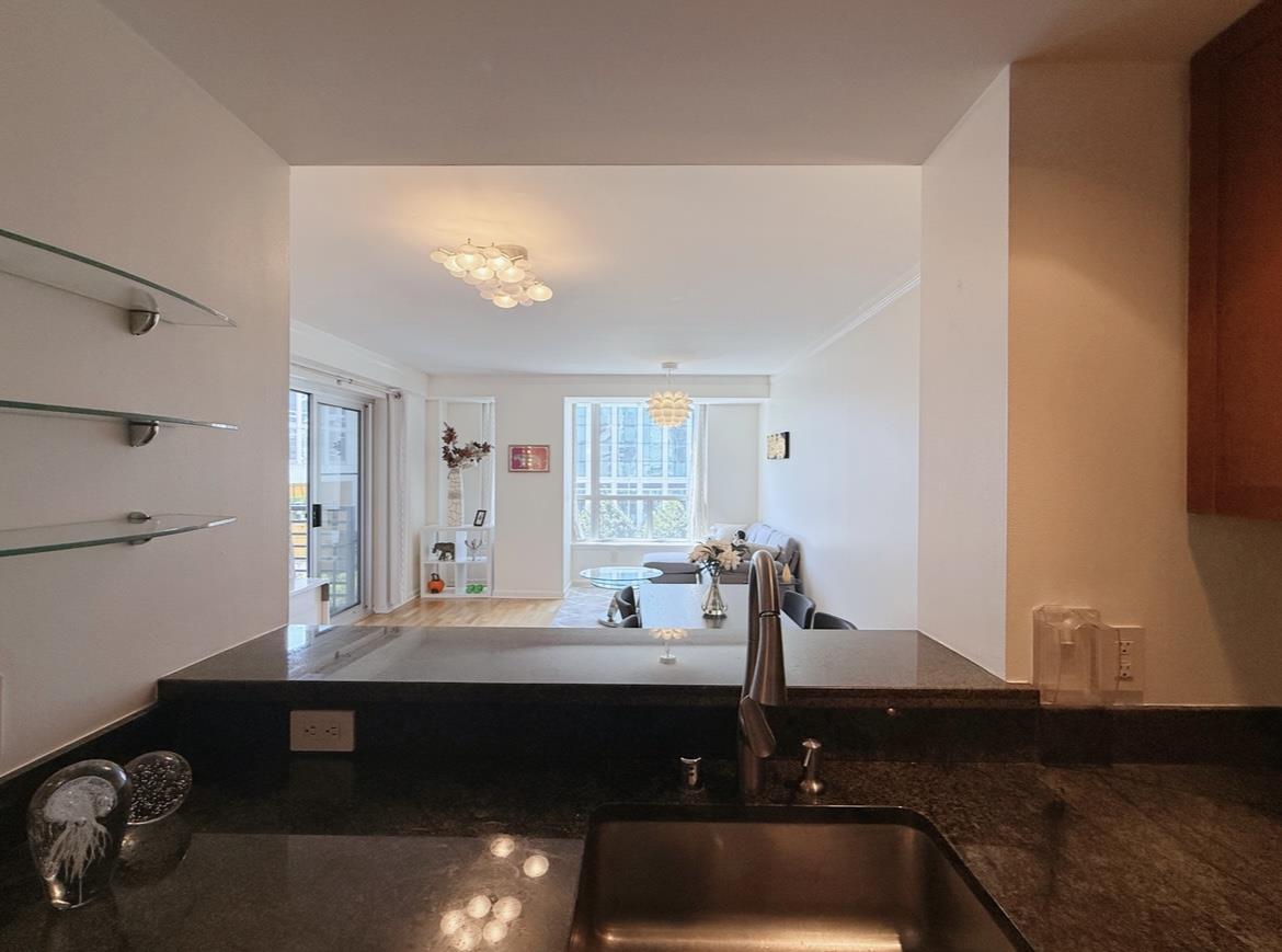 400 Beale Street, Unit 1102 San Francisco, CA 94105 - Photo 9 of 26 a room with a table chairs and a window