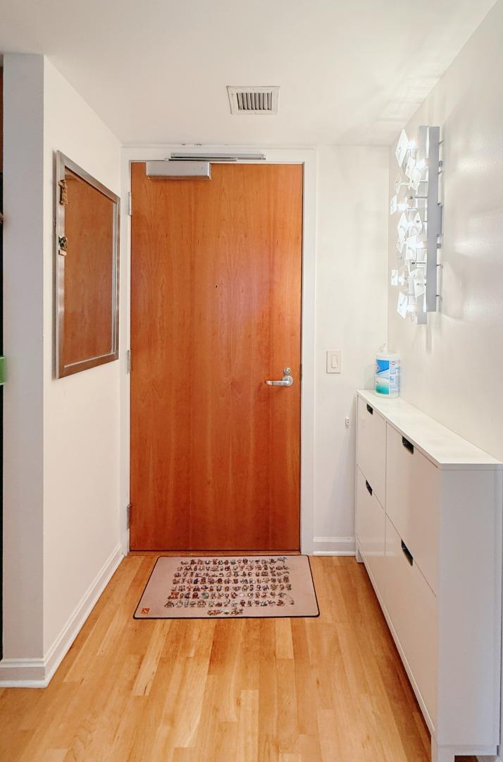 400 Beale Street, Unit 1102 San Francisco, CA 94105 - Photo 10 of 26 a view of an empty room with window and cabinet