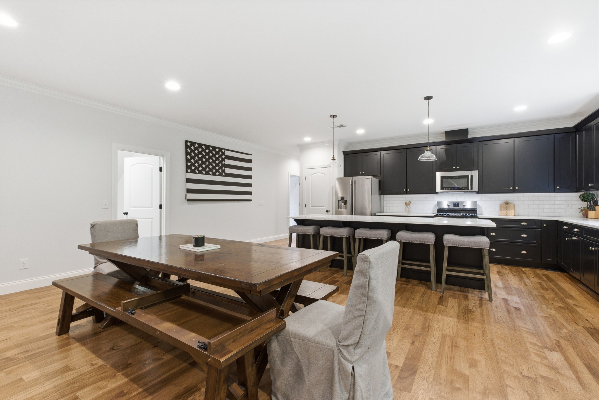 7075 Pinewood Road Nunnelly, TN 37137 - Photo 16 of 49 a living room with stainless steel appliances kitchen island a table and chairs