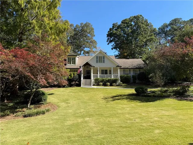 a front view of a house with swimming pool