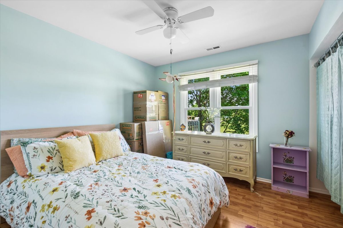 166 Hemingway Court, Unit 252 Vernon Hills, IL 60061 - Photo 13 of 18 a bedroom with a large bed and a window