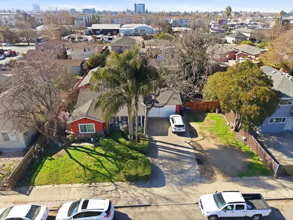 an aerial view of residential houses with outdoor space