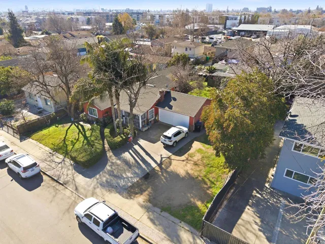 an aerial view of a houses with yard