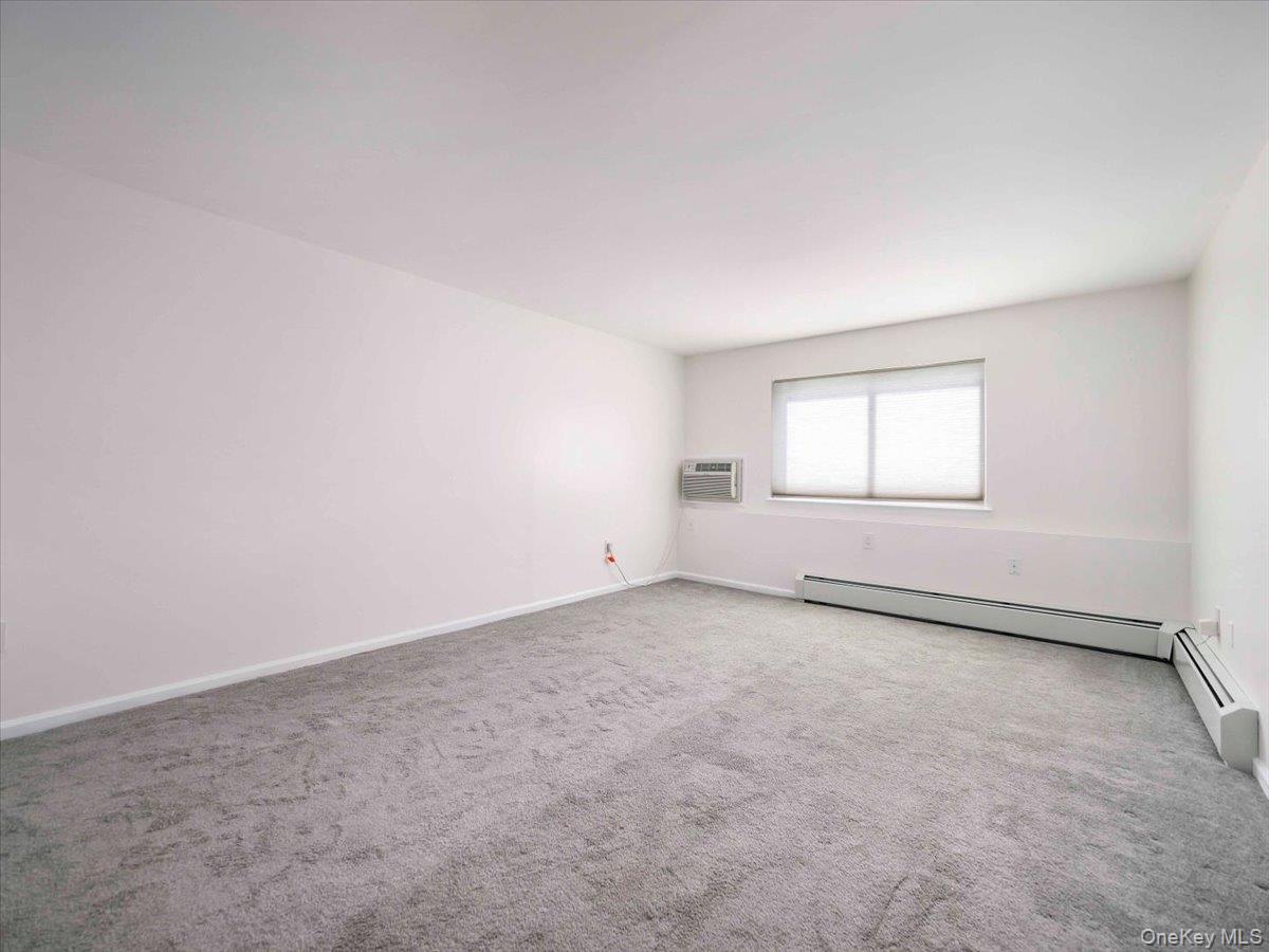 27 Tanager Road, Unit 2702 Monroe, NY 10950 - Photo 20 of 35 Spacious room featuring neutral carpeting and white painted walls