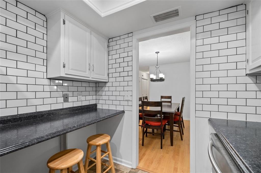 6851 Roswell Road, Unit D28 Atlanta, GA 30328 - Photo 12 of 28 a kitchen with a sink and a stove