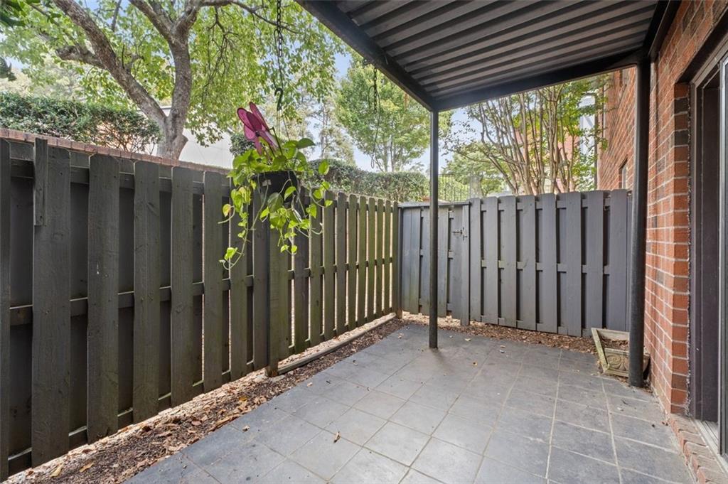 6851 Roswell Road, Unit D28 Atlanta, GA 30328 - Photo 14 of 28 a view of porch with wooden floor and furniture
