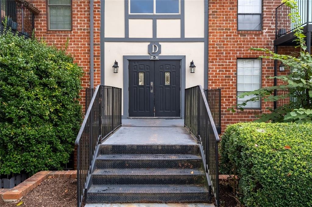 6851 Roswell Road, Unit D28 Atlanta, GA 30328 - Photo 2 of 28 a front view of a house