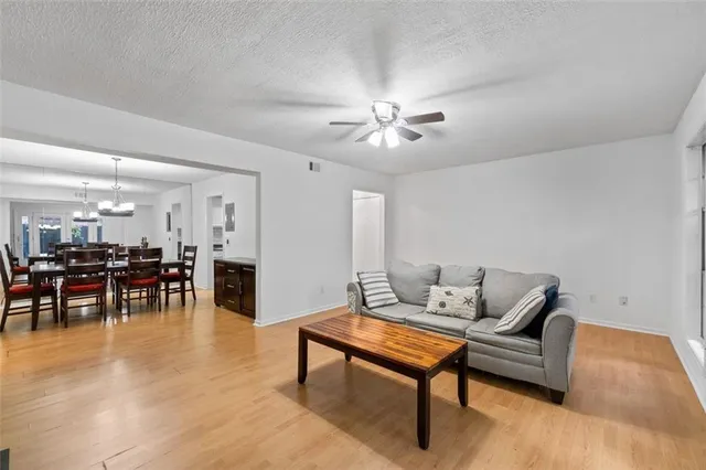 a living room with furniture and a table