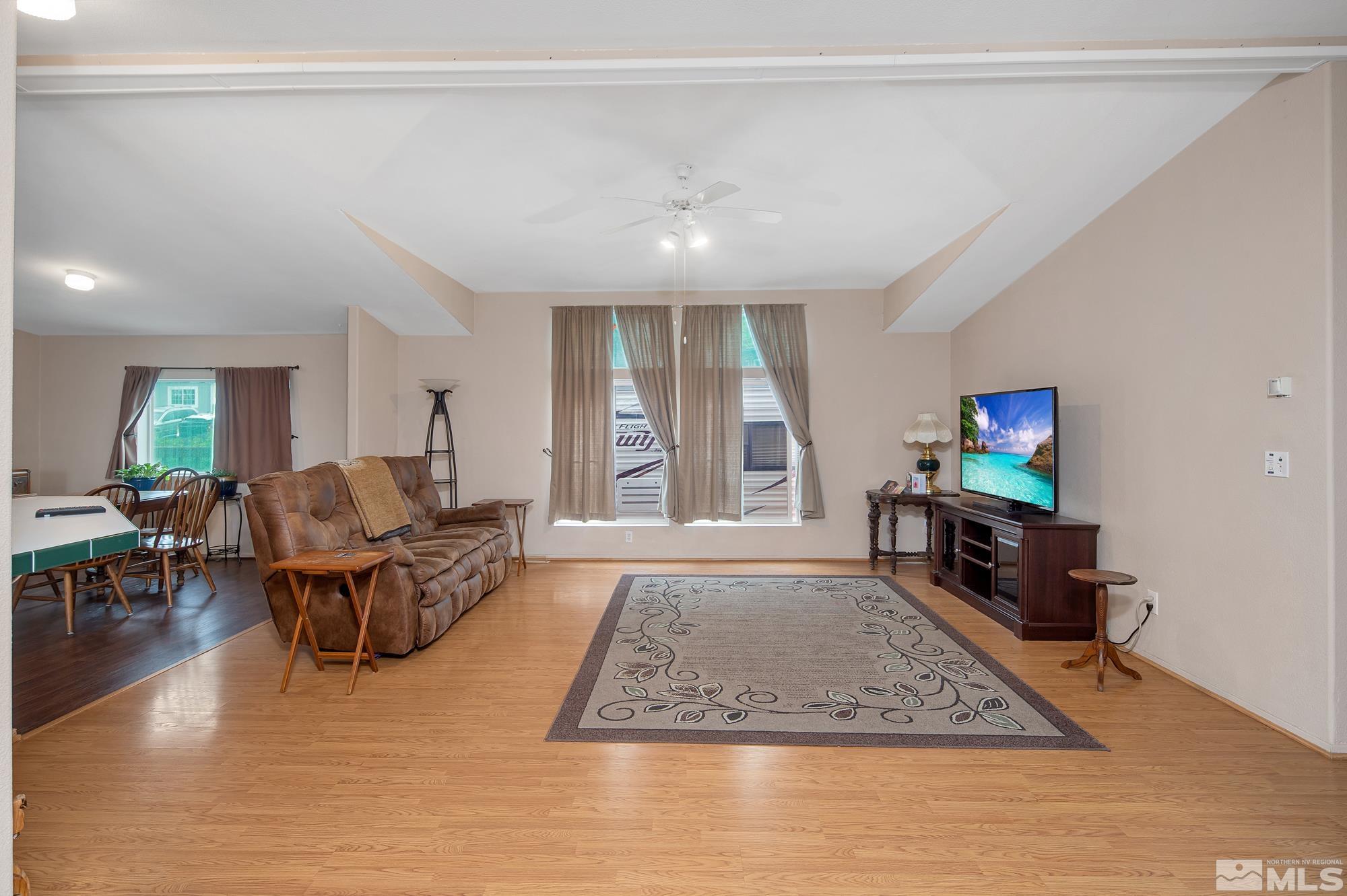 4963 Newport Court Reno, NV 89506 - Photo 5 of 19 a living room with furniture and a flat screen tv