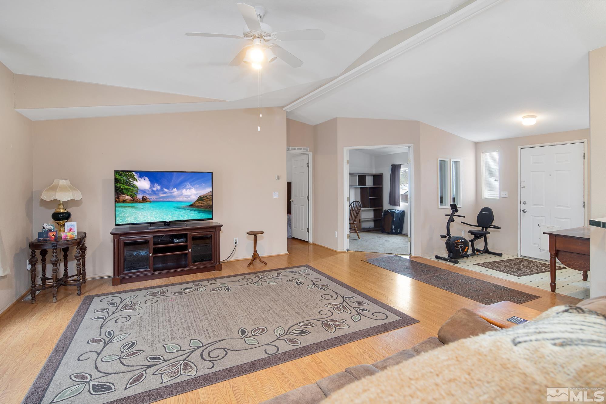 4963 Newport Court Reno, NV 89506 - Photo 6 of 19 a living room with furniture and a flat screen tv