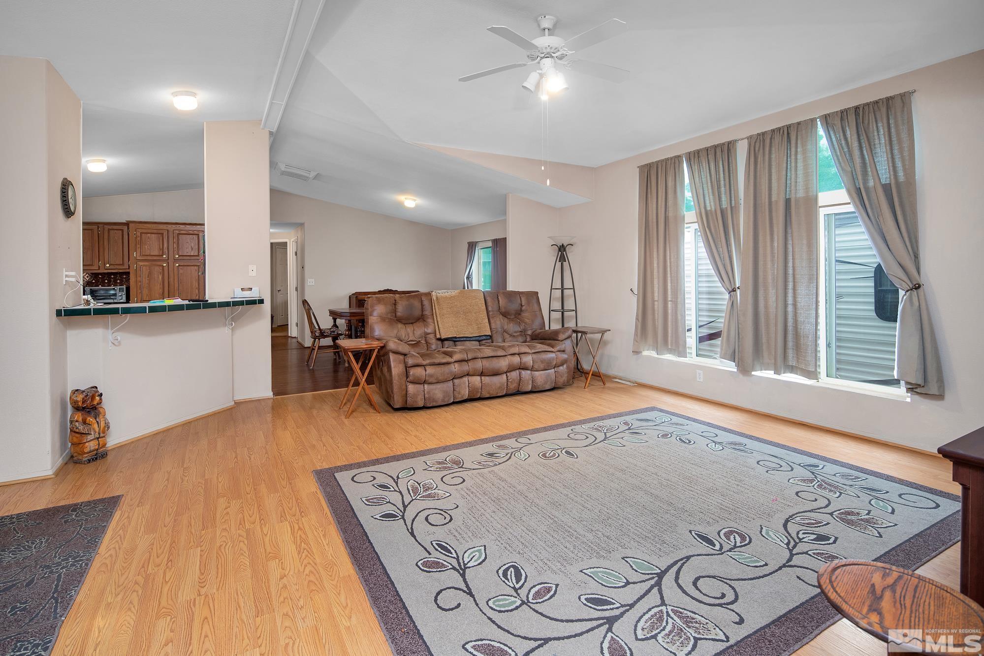 4963 Newport Court Reno, NV 89506 - Photo 8 of 19 a living room with furniture and a wooden floor