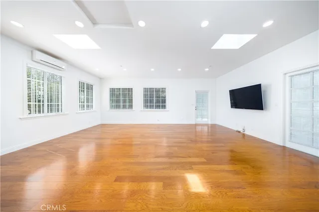 a view of an empty room with windows
