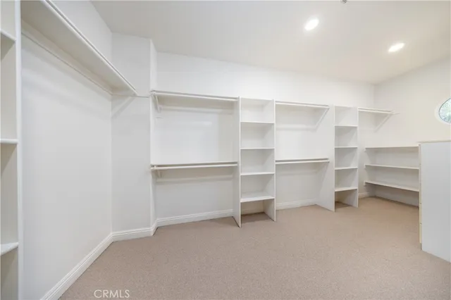 a bathroom with a granite countertop sink a mirror and a shower