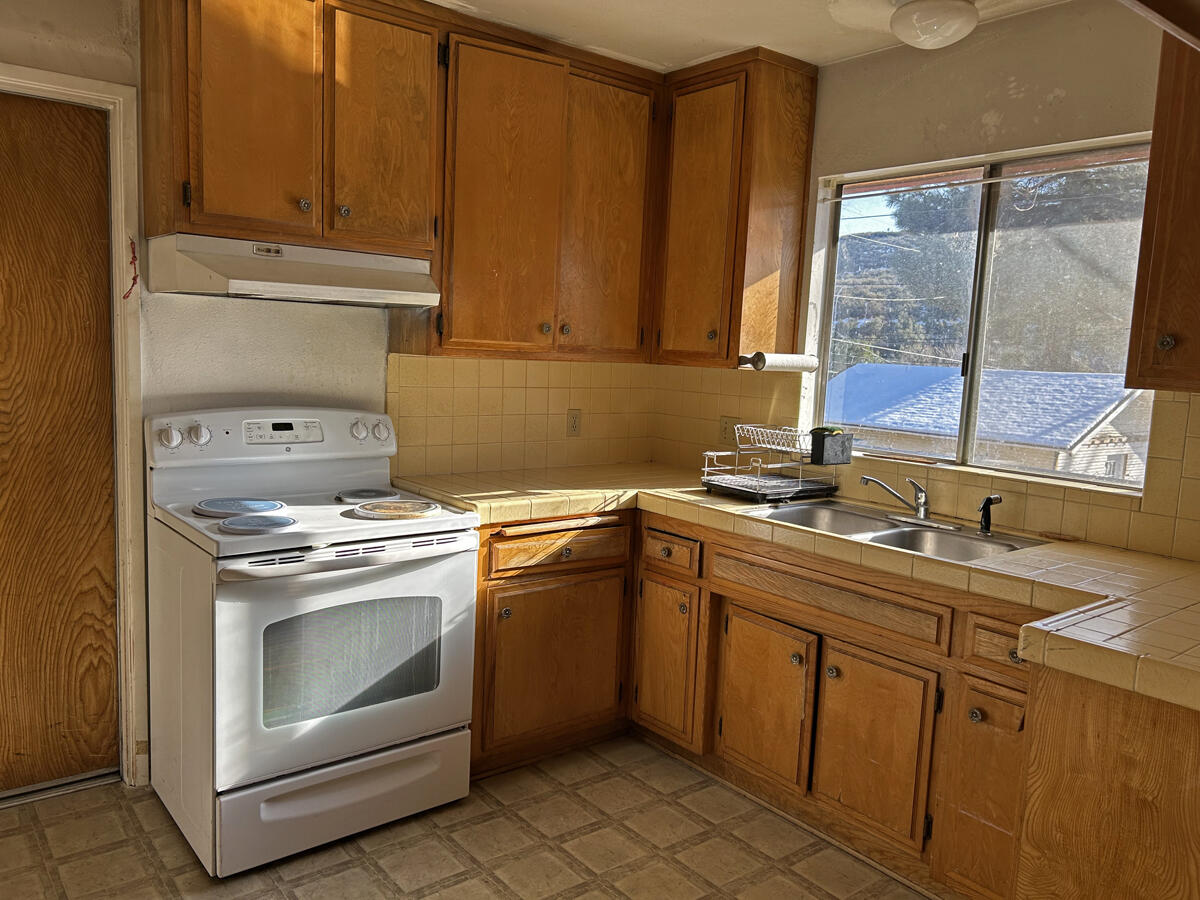 43729 Lakeview Road Lake Hughes, CA 93532 - Photo 9 of 16 a kitchen with a sink stove and cabinets