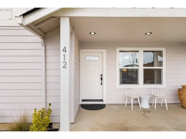 a view of an entryway with wooden floor
