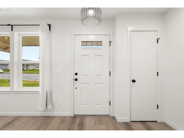 a view of a livingroom with wooden floor