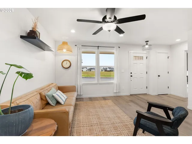 a living room with furniture and a window