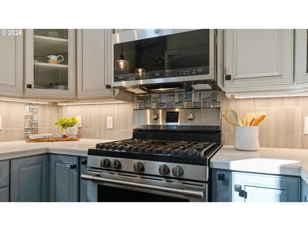 a kitchen with a stove and a microwave