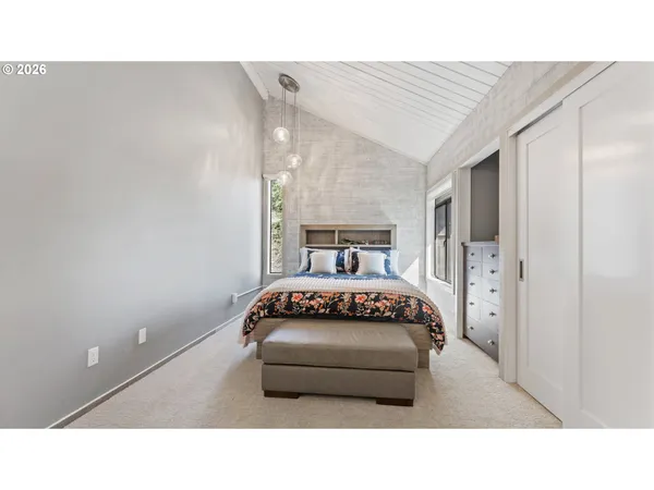 a bedroom with a bed and a view of bathroom