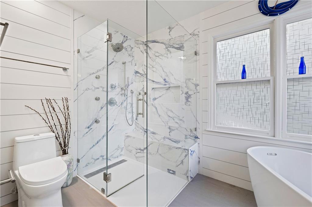 110 River Terrace Point Roswell, GA 30076 - Photo 13 of 24 a bathroom with a toilet and a shower