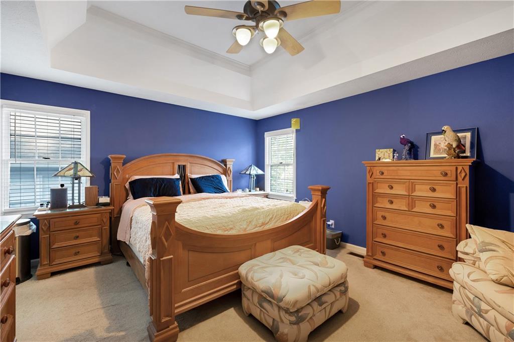 110 River Terrace Point Roswell, GA 30076 - Photo 14 of 24 a bedroom with a bed and a dresser