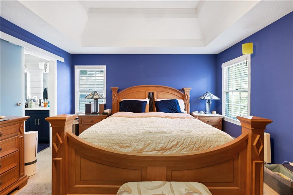 110 River Terrace Point Roswell, GA 30076 - Photo 15 of 24 a bedroom with a bed and wooden floor