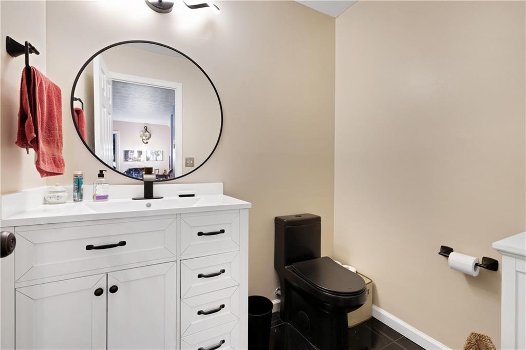 110 River Terrace Point Roswell, GA 30076 - Photo 16 of 24 a bathroom with a sink and a mirror