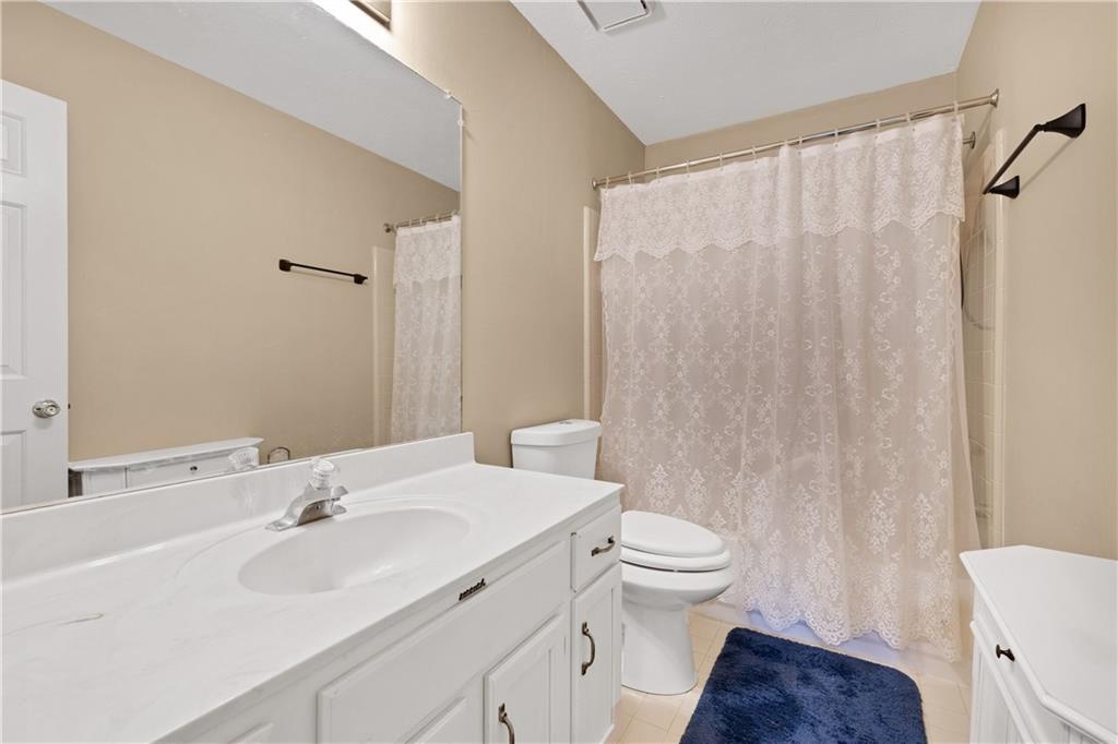 110 River Terrace Point Roswell, GA 30076 - Photo 17 of 24 a bathroom with a sink toilet and shower