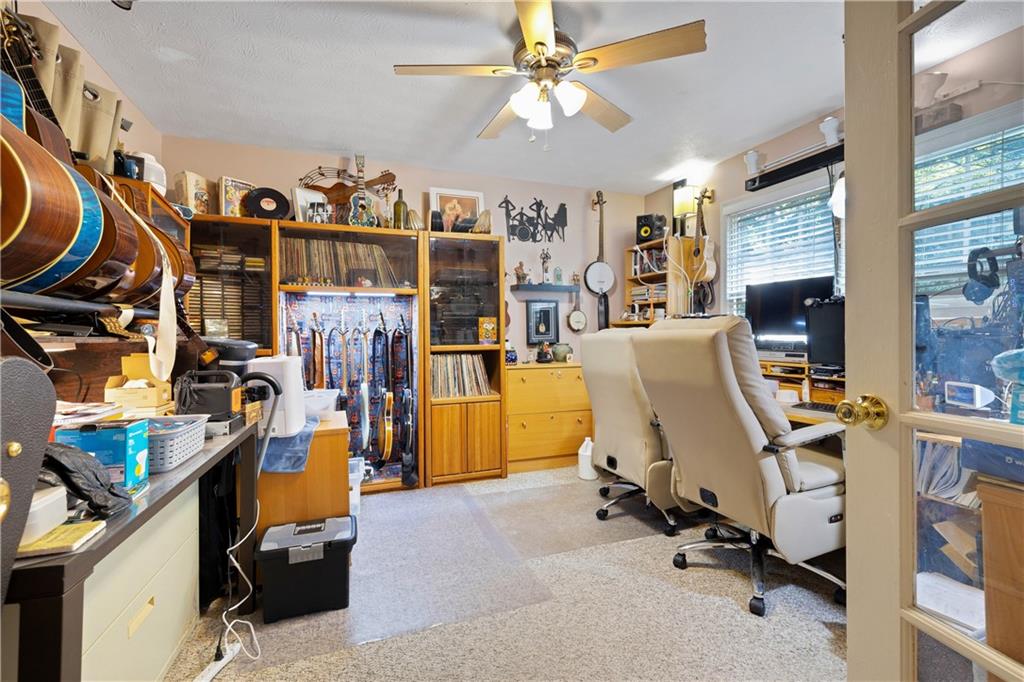 110 River Terrace Point Roswell, GA 30076 - Photo 20 of 24 a view of a workspace with furniture and a window
